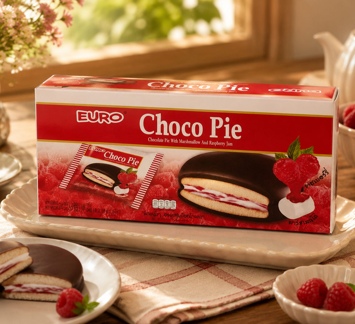 Box of Euro Choco Pie on a table with tea and berries