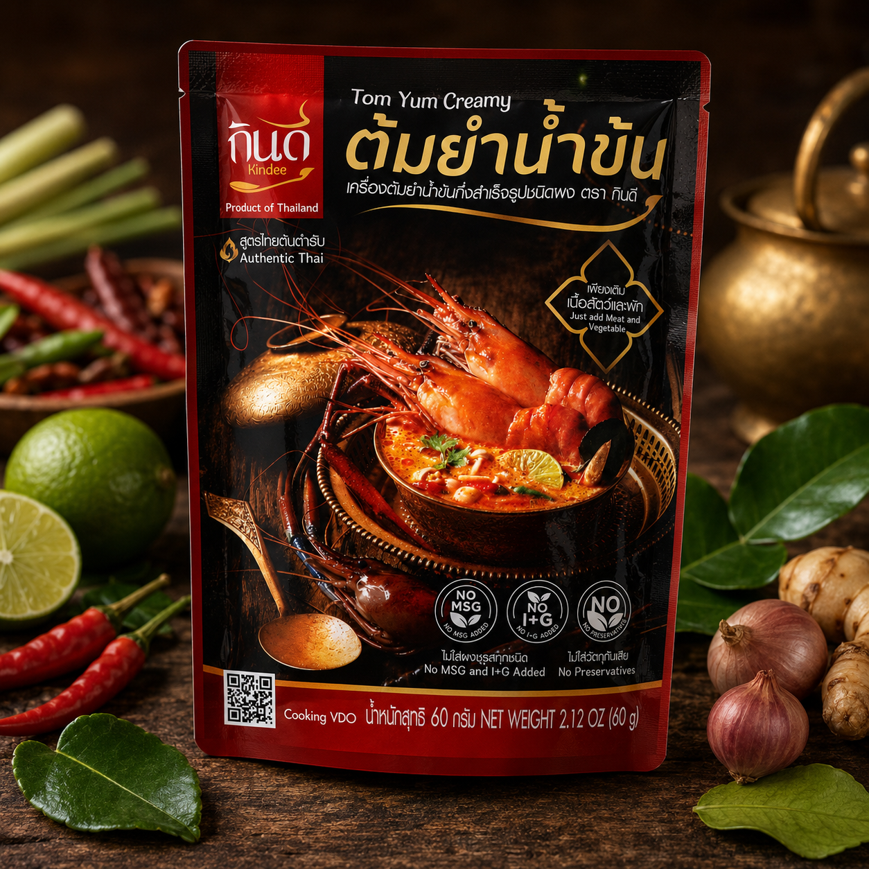 Tom Yum Creamy soup package with Thai ingredients on a wooden background