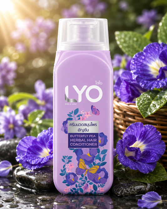 LYO butterfly pea herbal hair conditioner bottle with purple flowers in the background