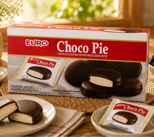Box of Euro Choco Pie on a table with cookies and a cup of coffee.