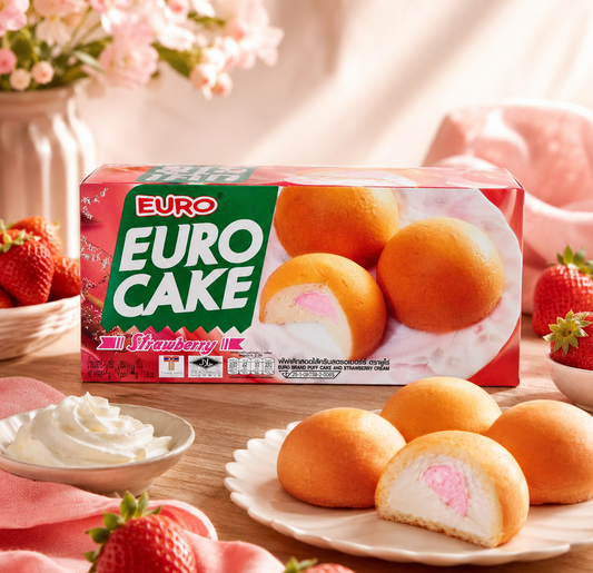 EURO CAKE strawberry flavor packaging with cake rolls on a wooden table.